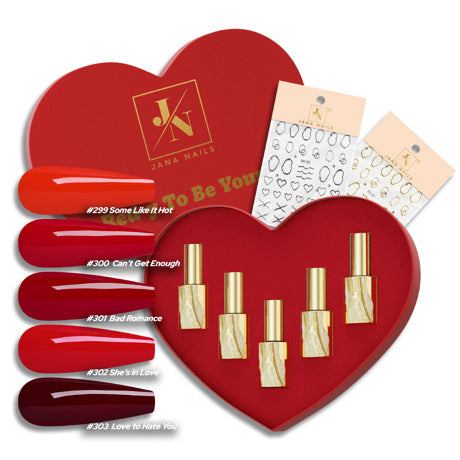Heart-shaped box with five red nail polish colors and two sticker sets, "Red-y To Be Yours" collection.