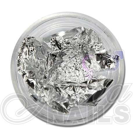 Nuggets foil silver for nail art applications in a clear container.